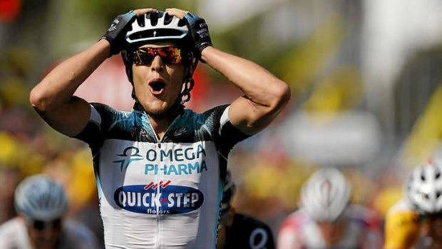 Matteo Trentin celebrates as he wins Stage 14.