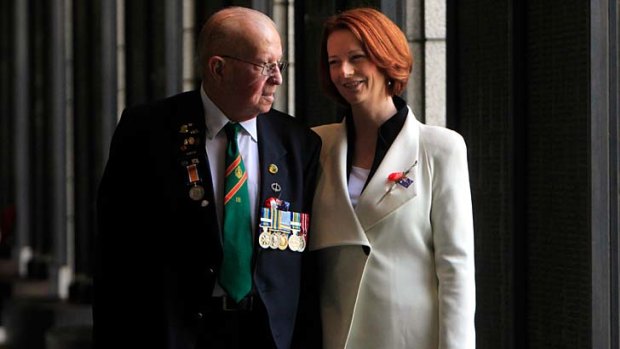 Return trip...  Alfred Smith, who served with the 3rd battalion Royal Australian Regiment in Korea, walks with the Prime Minister, Julia Gillard, in Seoul.