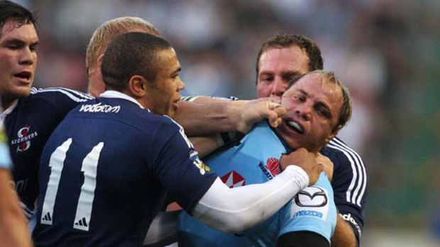Tough talk ... NSW captain Phil Waugh is roughed up by the Stormers’ Bryan Habana during a scuffle in their last encounter in February.