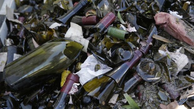 Broken bottles from the library wines of Saintsbury winery fill a grape bin.