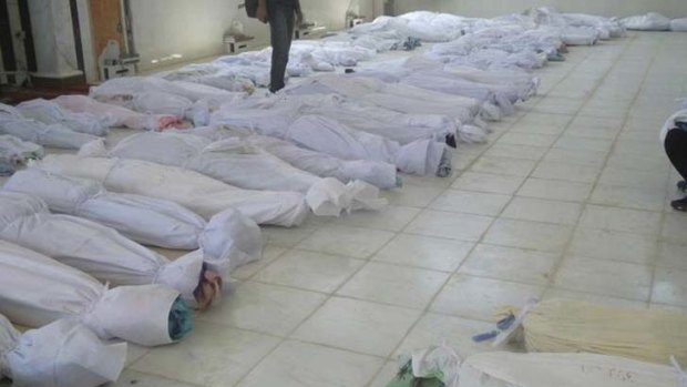 Counting the dead ... more than 92 people, including 32 children, were massacred in the town of Houla.