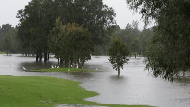 Flash flooding almost submerges the golf course at Beresfield, Newcastle.
