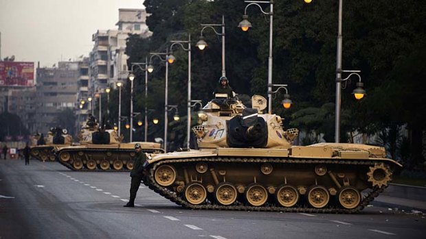 Egyptian army tanks deployed outside the presidential palace in Cairo.
