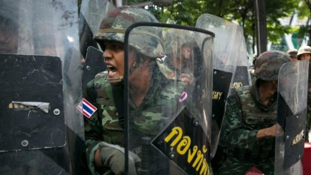 Thai military on the defensive during an anti-coup protest.