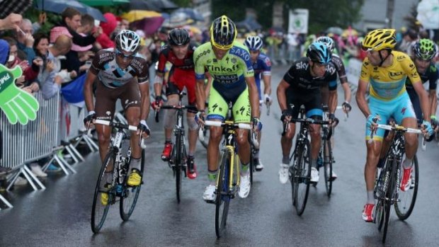 Under pressure: Alberto Contador (c) launches his attack with Vincenzo Nibali (R) and Richie Porte (2nd R) ready to respond.