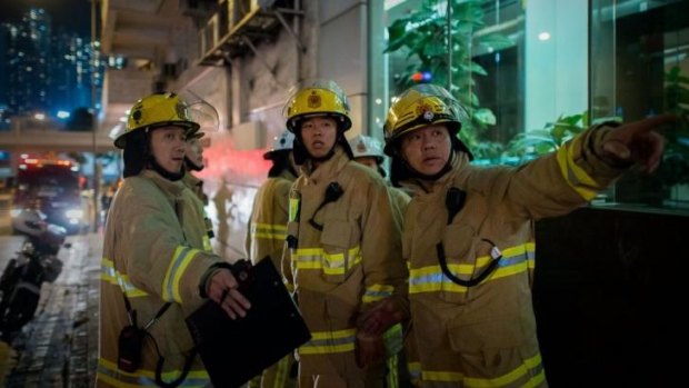 Evacuations: Firemen respond to the bomb emergency in Hong Kong.