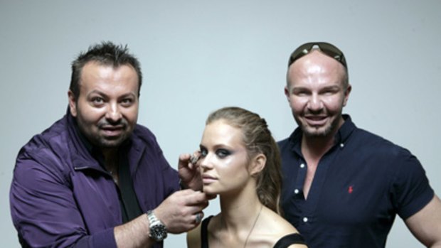 Shared background... make-up artist Napoleon Perdis puts the finishing touches on a model while designer Alex Perry looks on.
