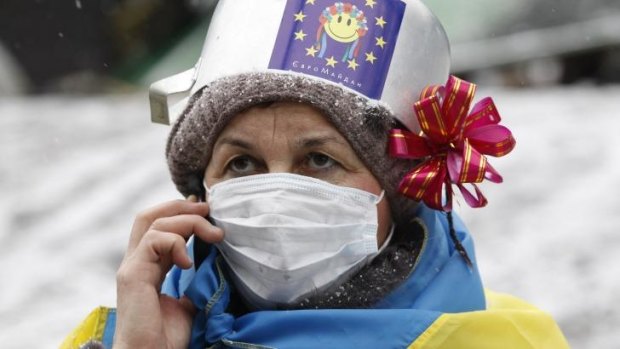 A demonstrator speaks on the phone during a rally held by pro-European integration protesters in Kiev.