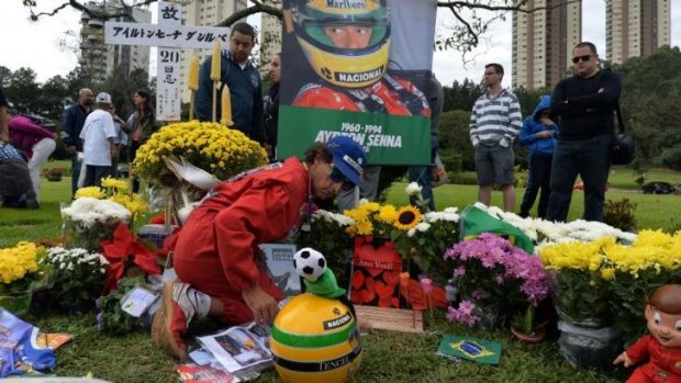 People visit Ayrton Senna's grave in Sao Paulo on May 1, the 20th anniversary of his death.