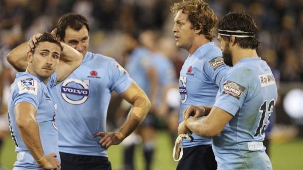 Reality check: Waratahs players react after the loss to the Brumbies.