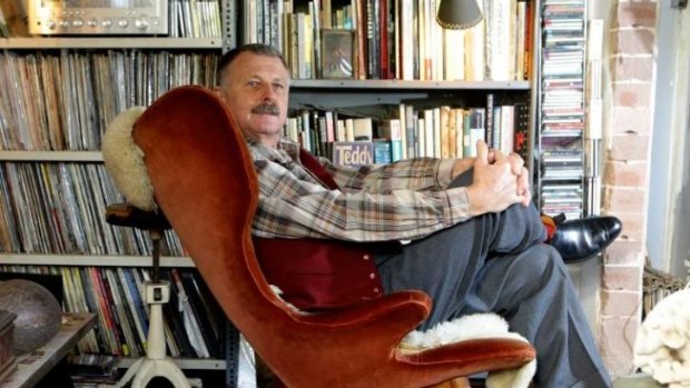 Sitting pretty on his collector's chair: Ken Neale in his living room with his 1950s Featherston Wing Back.