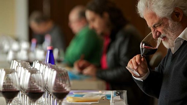 A good drop ... South African wine expert Michael Fridjhon tests the cabernet range of wines at the challenge.
