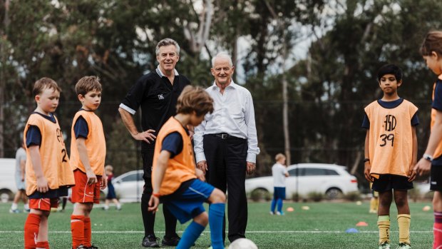 Smooth operators: Pennant Hills FC vice president Grahame Bateman and Hornsby mayor Phillp Ruddock on the synthetic field. 