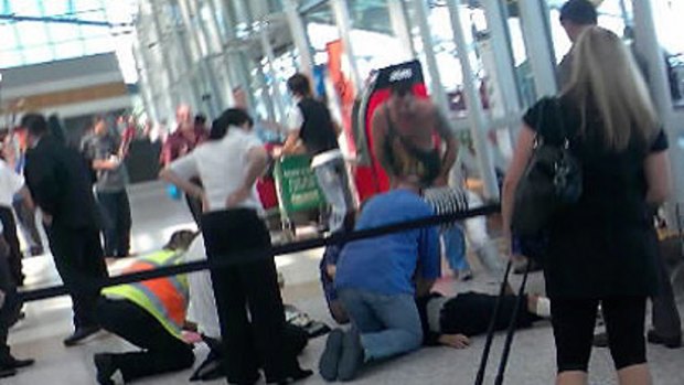 A Hells Angels bikie was killed in a huge brawl at Sydney Airport