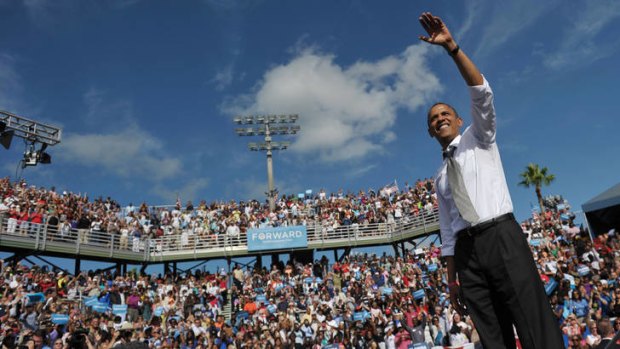 Last lap ... Barack Obama waves after speaking at Delray Beach, Florida.
