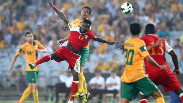 Star: Tim Cahill, shown scoring against Oman, wants his teammates to keep their focus.