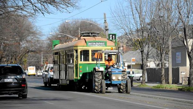 Melbourne-bound: a tractor tows the fully restored W-class tram through Bendigo to a waiting a semi-trailer.