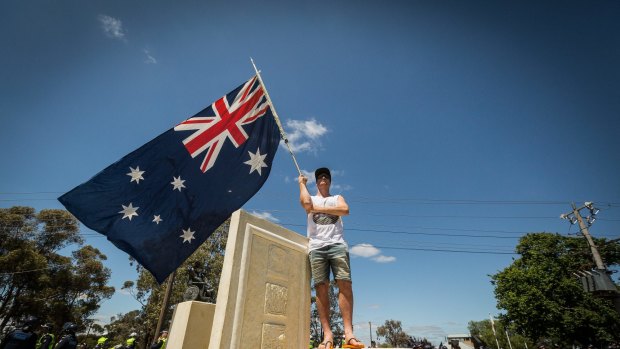 Dude, really? Isn't standing on the monument pretty darn disrespectful? And doing so in thongs is an OH&S issue waiting to happen.