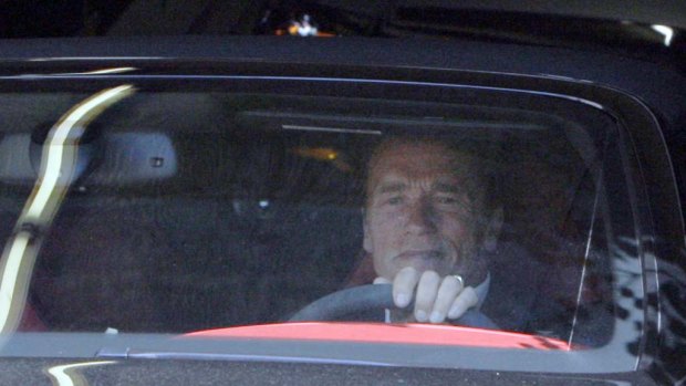 Arnold Schwarzenegger leaves his office on  Tuesday.