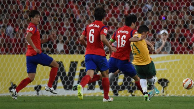 Massimo Luongo fires home the opening goal for the Socceroos. 