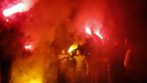 Supporters of Turkey's ruling Justice and Development Party celebrate on Sunday.