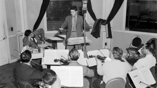 Bernard Herrmann, centre, at work. The MSO will open its 2016 season with a show dedicated to the composer and his work with director Alfred Hitchcock.