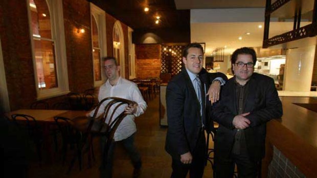 Lorenz Grollo leans on Guy Grossi in their new restaurant, Merchant, which opens at the Rialto next month.