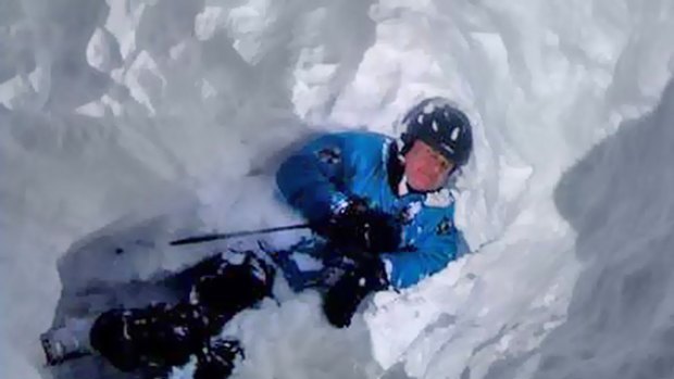 John Castran buried in snow after the avalanche. The picture was taken by a rescuer.