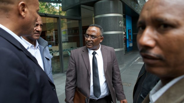 Victim Michael Atakelt's father, Getachew Seyoum (centre), believes the investigation into his son's death was mishandled.