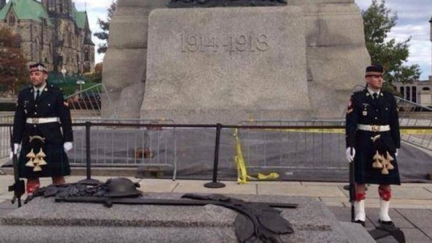 Corporal Nathan Frank Cirillo, left, stands guard at the war memorial in Ottawa with the Argyll and Sutherland Highlanders of Canada three days before his death.