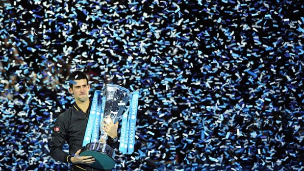 Cup runneth over: Novak Djokovic with the World Tour Finals trophy.