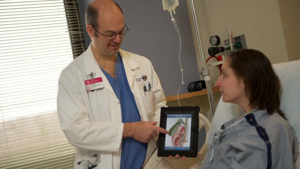 Pioneering: Dr Henry Feldman of Harvard Medical School demonstrates the uses of iPad technology.