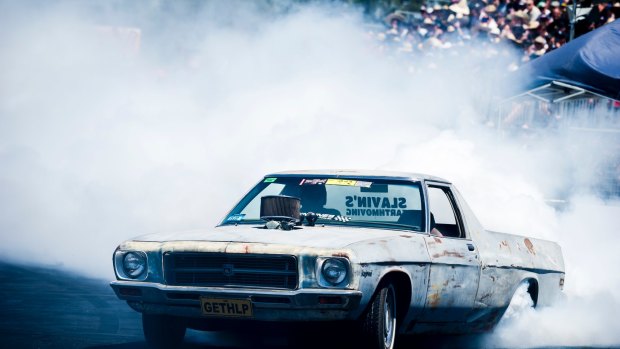 Cars compete in the burnout track at Summernats 31.