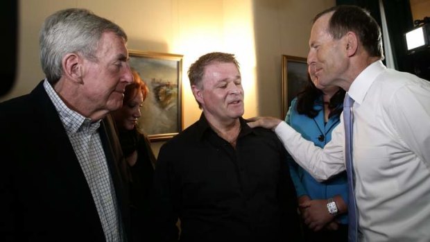 Opposition Leader Tony Abbott meets Bali bombing survivors Paul Anicich, left, and Peter Hughes, centre.