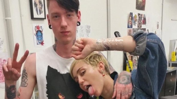 Myles Paten from Collingwood's Eureka  Rebellion Trading and "homie" Miley Cyrus on Thursday night.