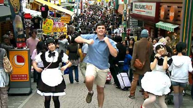 Dance craze ... Matt Harding dancing with Harajuku girls in Tokyo.