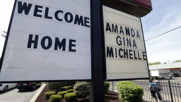 Ordeal over: A sign outside a restaurant near the Cleveland house where where three women were held captive for a decade.
