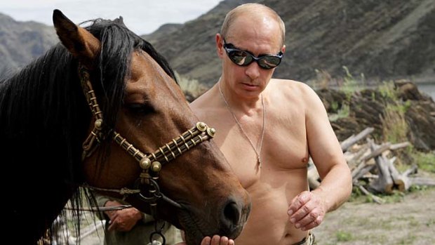 Hard line ... Russia's President Vladimir Putin feeds a horse outside the town of Kyzyl in Southern Siberia in 2009. The Russian strongman turned 60 on Sunday.