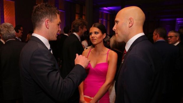 Joel Selwood chats with Gary Ablett and his partner, Jordan Papalia, at the All Australian team announcement ceremony on Tuesday night.