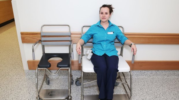 Rebecca Donnelly shows how chairs come in different sizes to cater for different patient needs at Campbelltown Hospital.