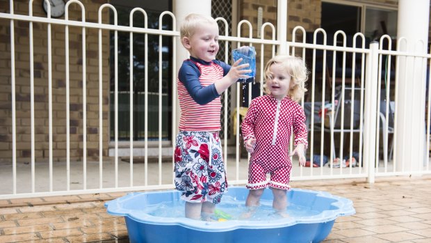 Three-year-old Hugh Ryder enjoys the warm weather in Grafton on Saturday with Eden Hiatt, aged two. 