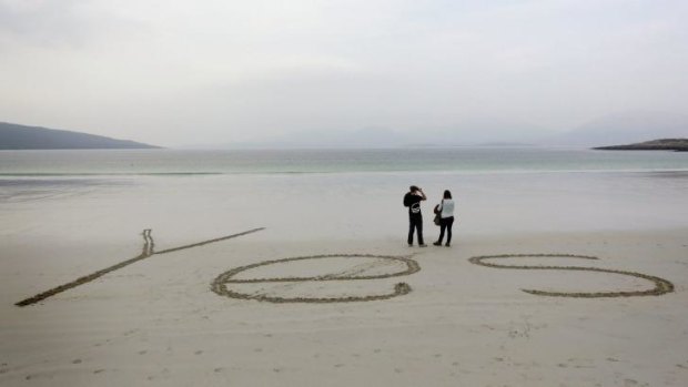 The word "Yes" is scrawled on the sand at Luskentyre beach on the Isle of Harris in the Outer Hebrides.