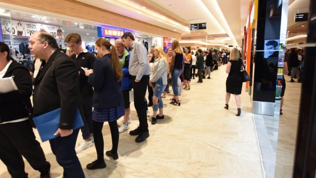 Hundreds of eager job seekers lining up at the Mandurah Forum job fair for a chance to meet potential employers in person. 