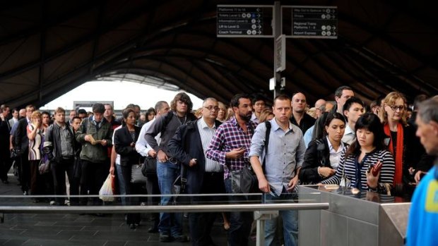 A bottleneck forms as commuters queue at Southern Cross Station.