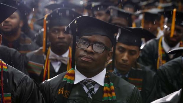 Graduates listen as Barack Obama delivers the commencement address at Morehouse College in Atlanta, Georgia.