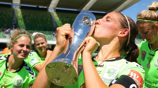 PERTH, AUSTRALIA - DECEMBER 21: Nicole Begg of Canberra kisses the trophy after winning the W-League Grand Final match between Perth and Canberra at nib Stadium on December 21, 2014 in Perth, Australia.  (Photo by Paul Kane/Getty Images)