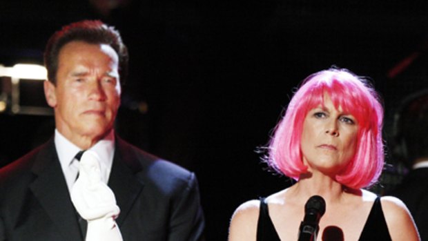 In the pink ... a recovering addict Jamie Lee Curtis receives the the "Courage To Care" award from California Governor Arnold Schwarzenegger.