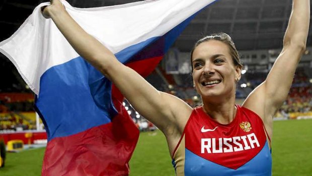 Russia's Yelena Isinbayeva celebrates after winning the women's pole vault final at the 2013 IAAF World Championships in Moscow.