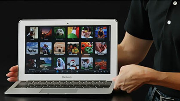 An Apple employee displays the new MacBook Air during an Apple special event at the company's headquarters.