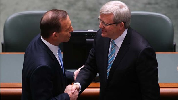 Head to head once more: Coalition leader Tony Abbott congratulates Kevin Rudd on his return to the prime ministership on Thursday.